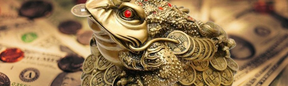Eine Kröte mit einer Währung im Mund ein Talisman, um Geld anzulocken